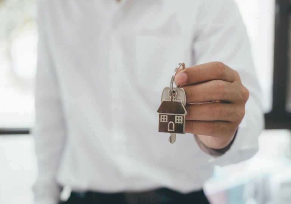 hand holding house keys