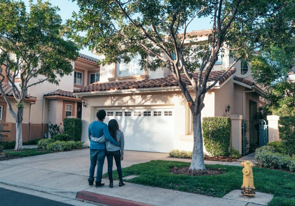 homeowners looking at their home from outside